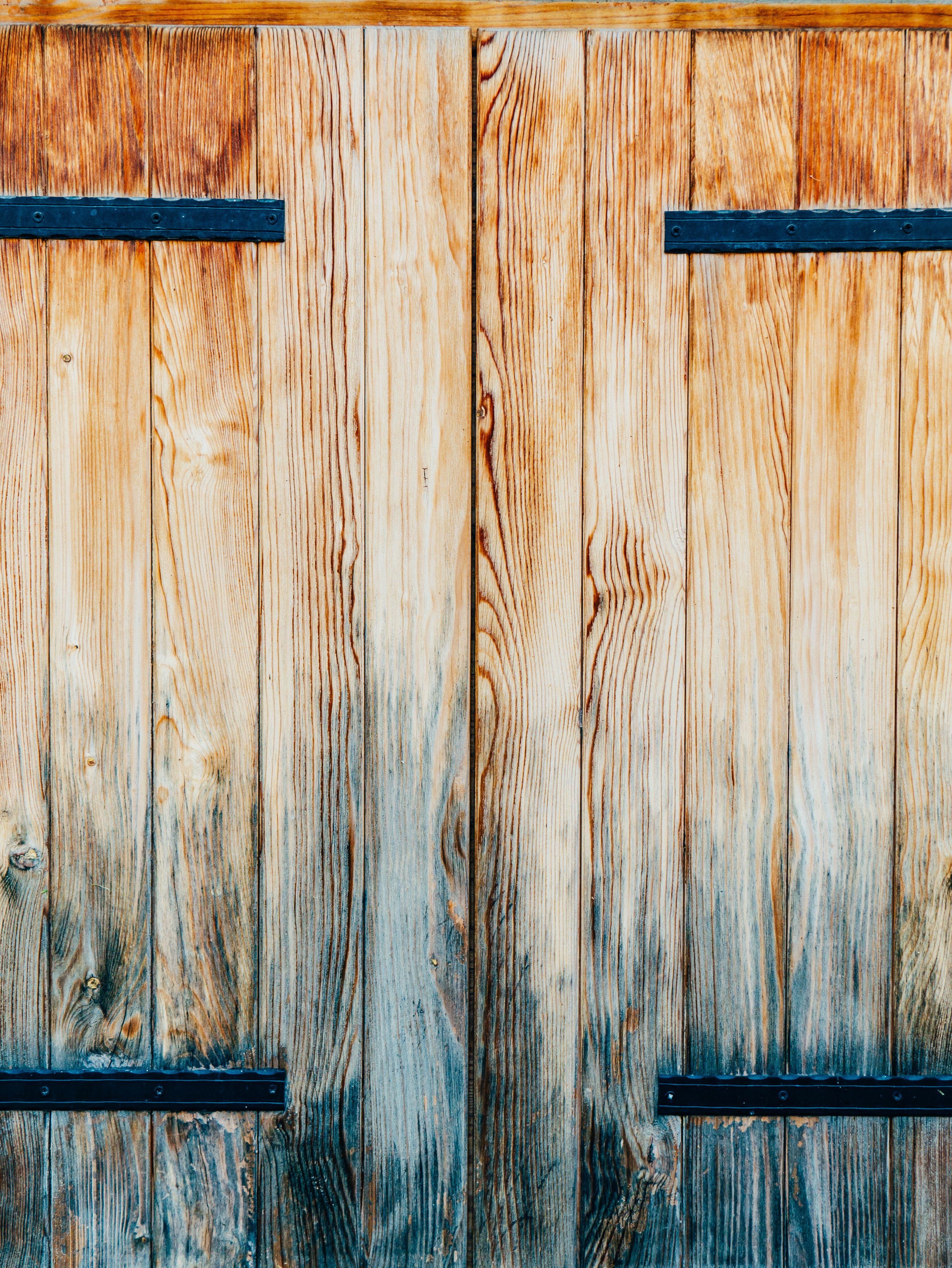 weathered wood armoire with sliding barn door hiding a cozy farmhouse coffee station