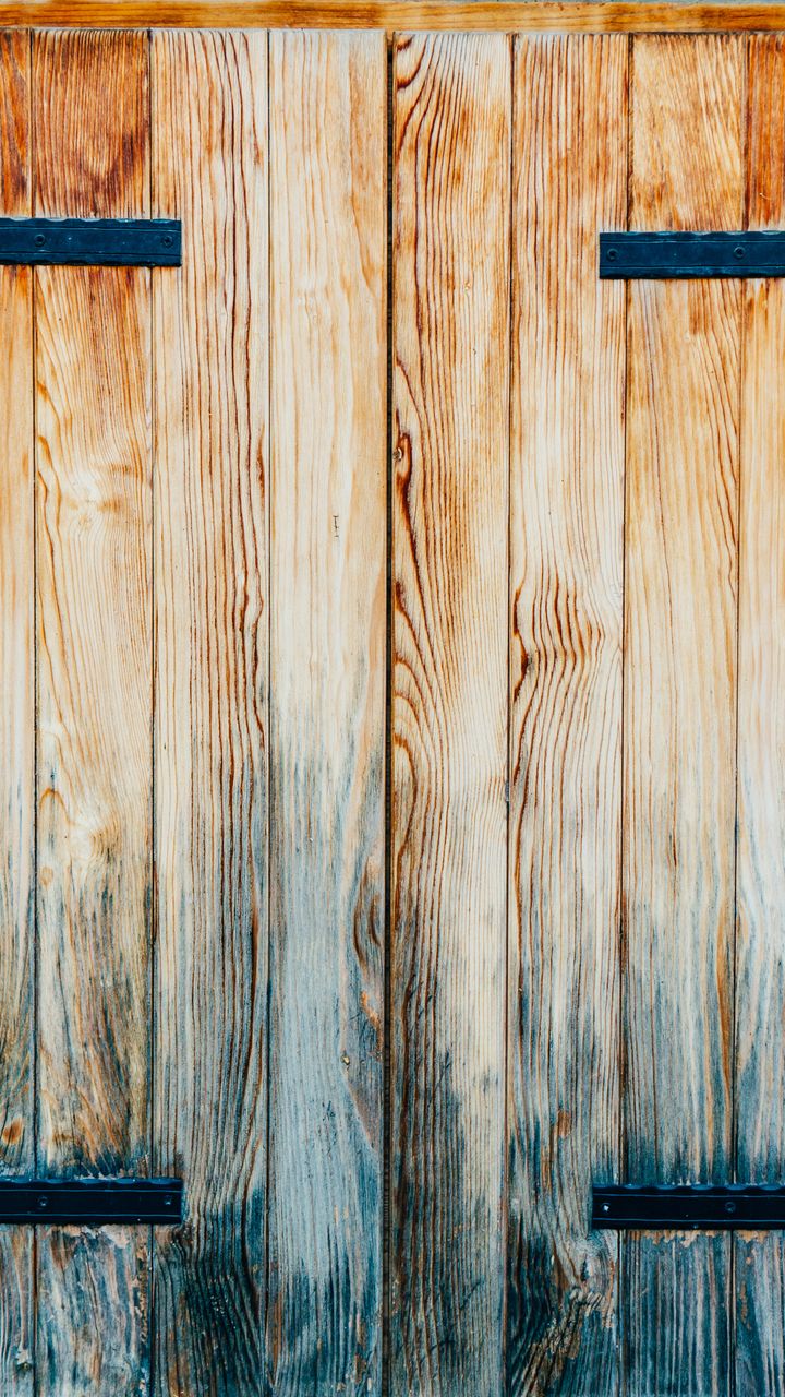 weathered wood armoire with sliding barn door hiding a cozy farmhouse coffee station