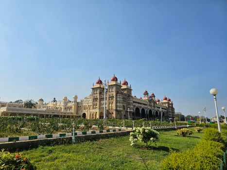 Stunning view of Mysore Palace in India on a sunny day, highlighting its architectural beauty.