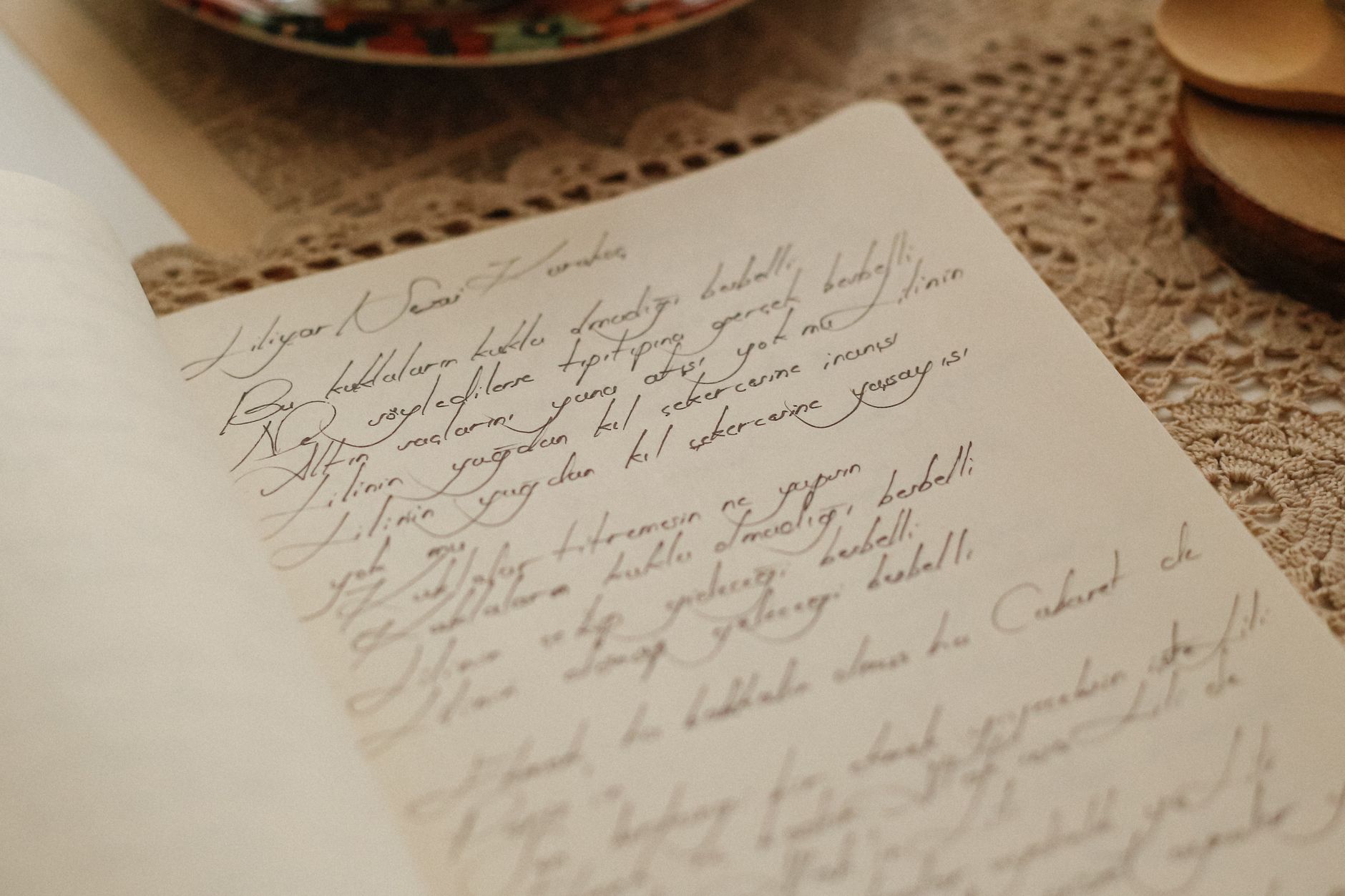 Close-up of an elegant handwritten letter on vintage paper, evoking nostalgia.