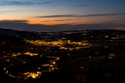 Twilight aerial view of Schwende-Rüte in Appenzell Innerrhoden, Schweiz with glowing lights.