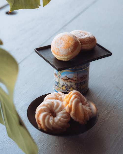 Free A cozy setup of Berliner and spritzkuchen pastries, perfect for indulgent snacking. Stock Photo