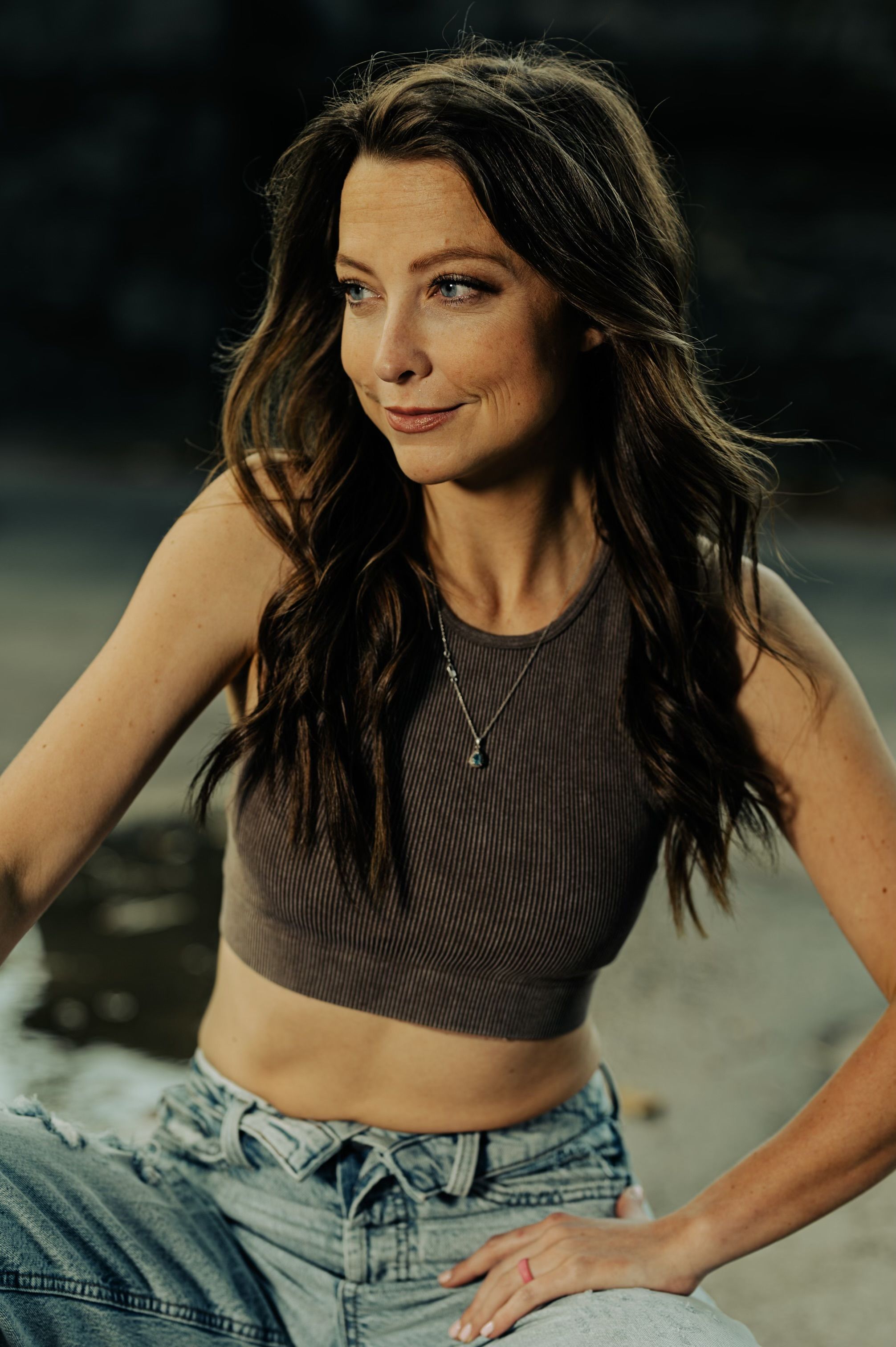 Young woman in casual attire posing confidently outdoors in Atlanta, Georgia.