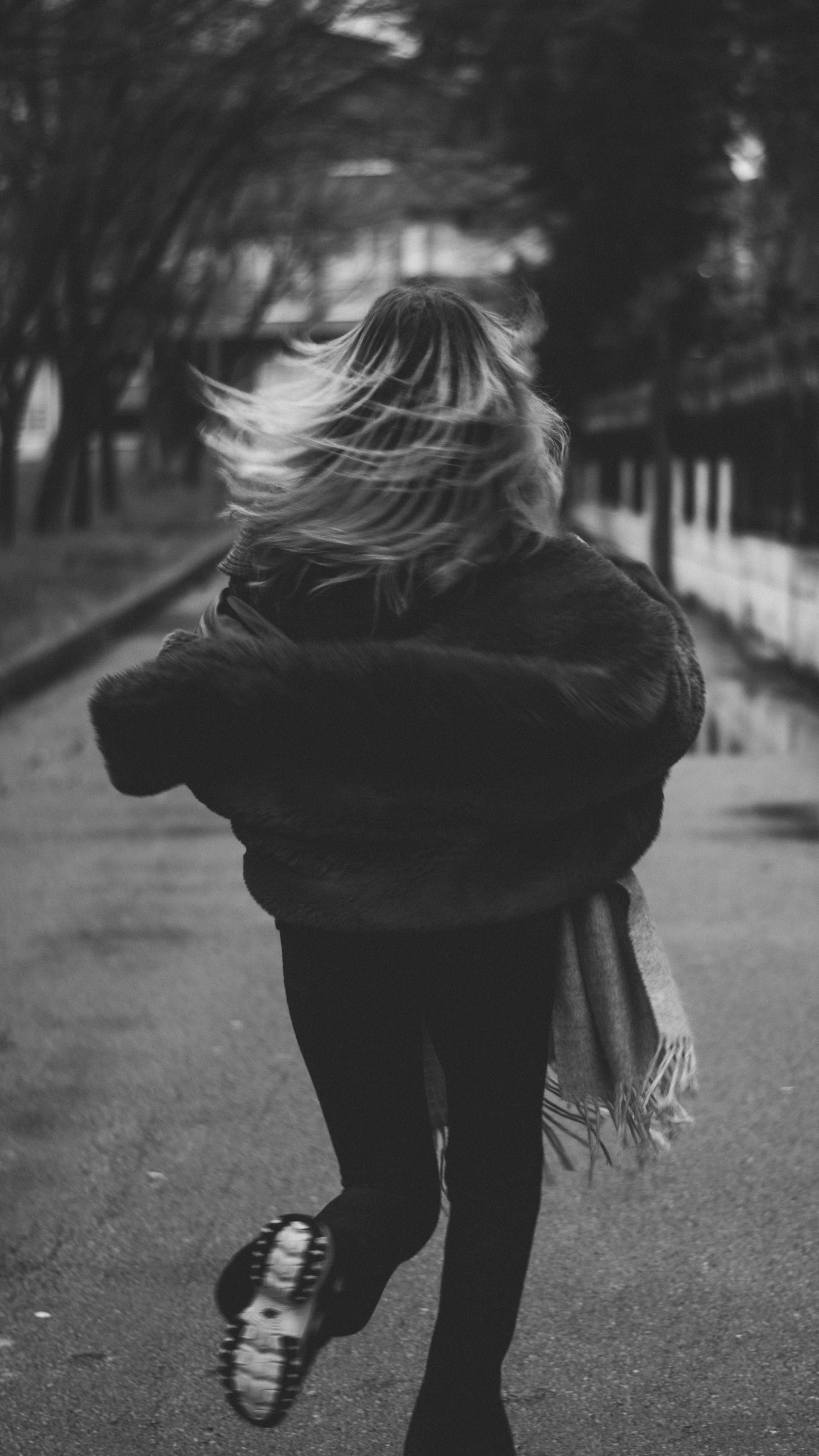 Black and White Image of Woman Running Outdoors · Free Stock Photo
