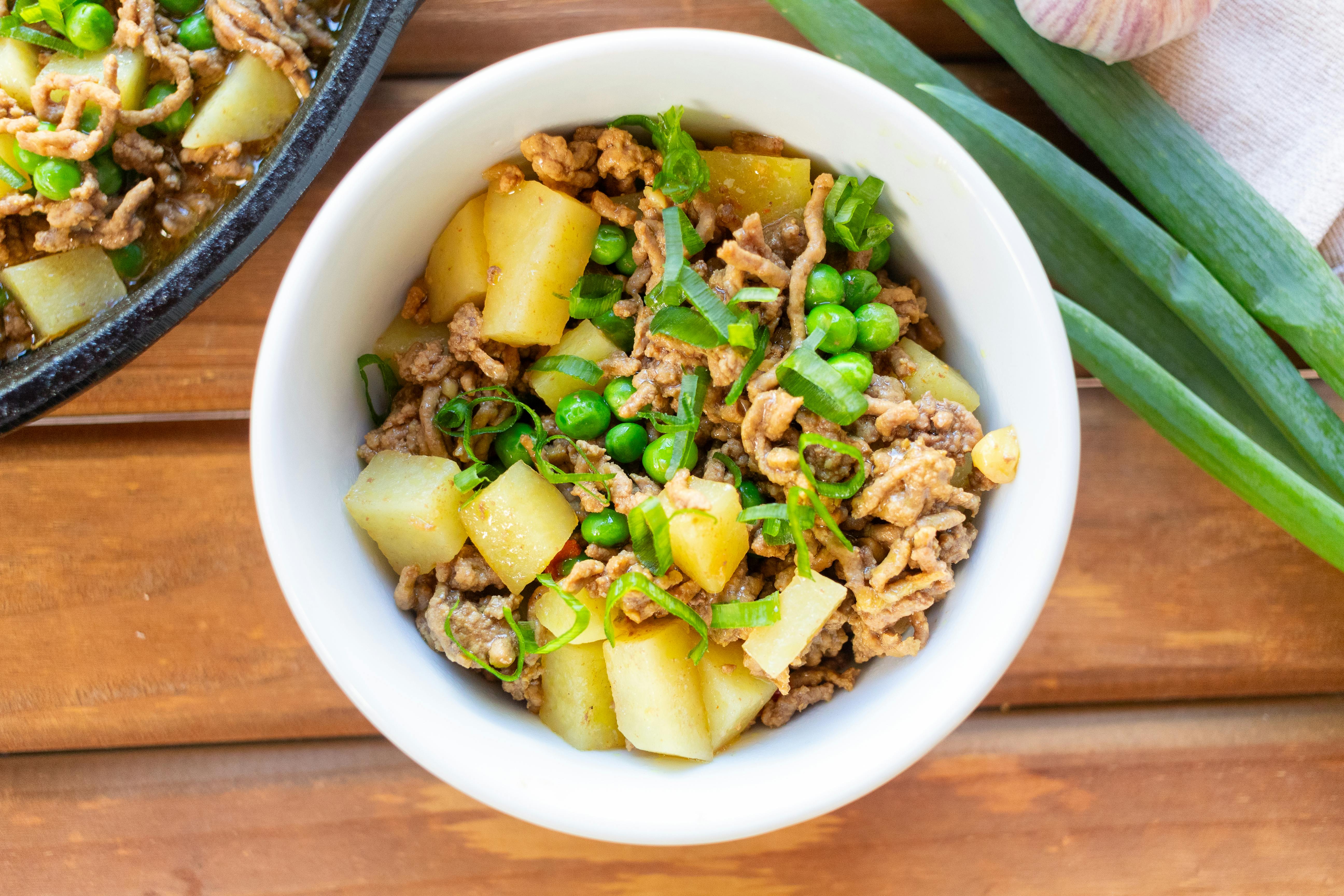 A spread of healthy, colorful, quick weeknight dinners on a wooden table