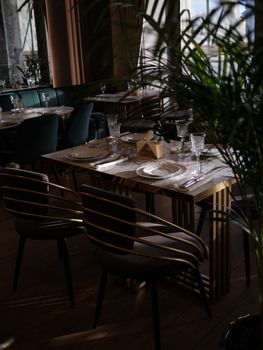 A beautifully arranged dining table in a chic, modern restaurant ambiance.