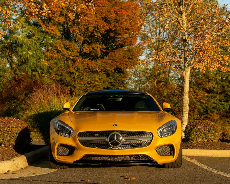 Professionally detailed luxury car glowing in warm evening light