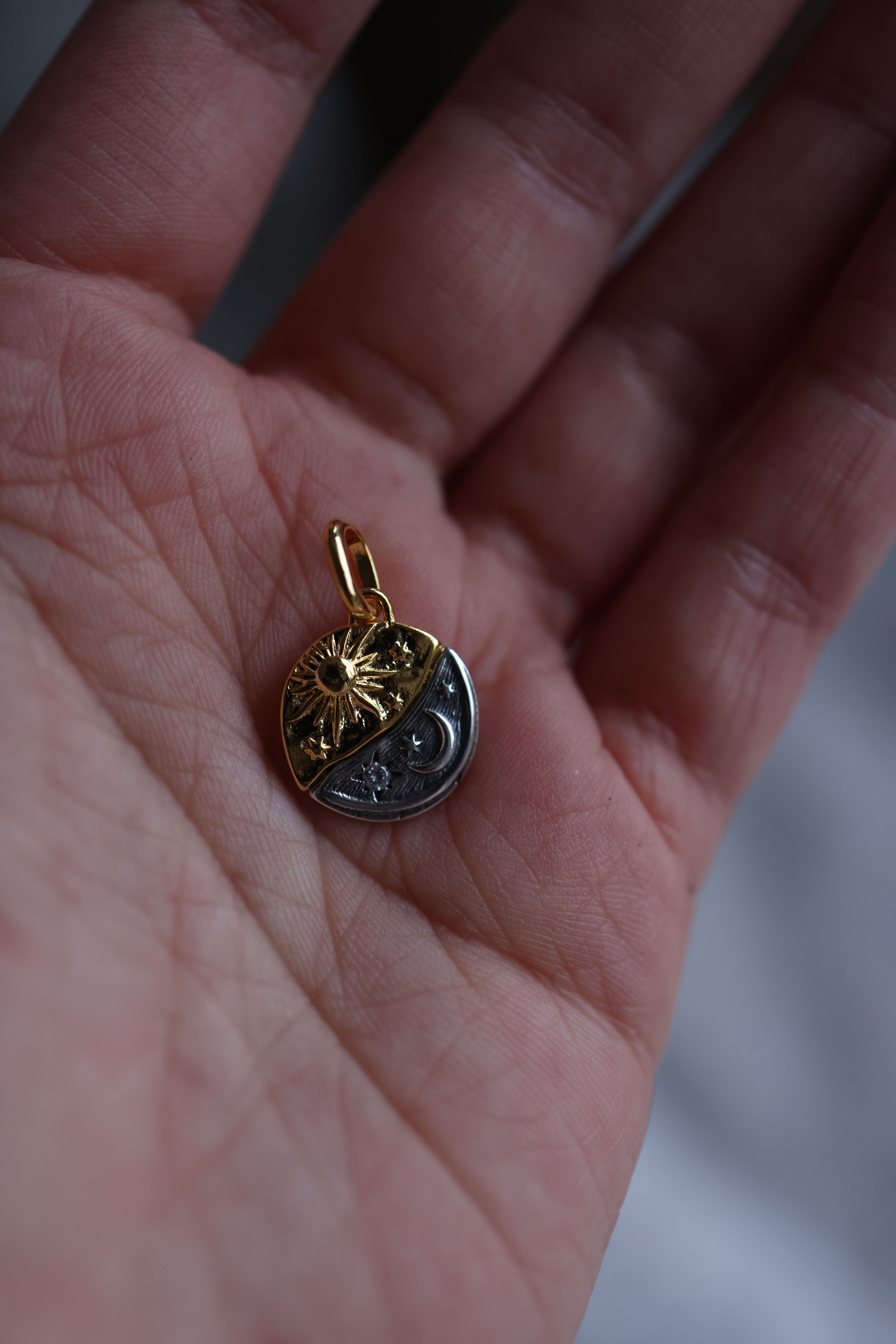 Sun and moon pendant charm — Valeria Boltneva on Pexels