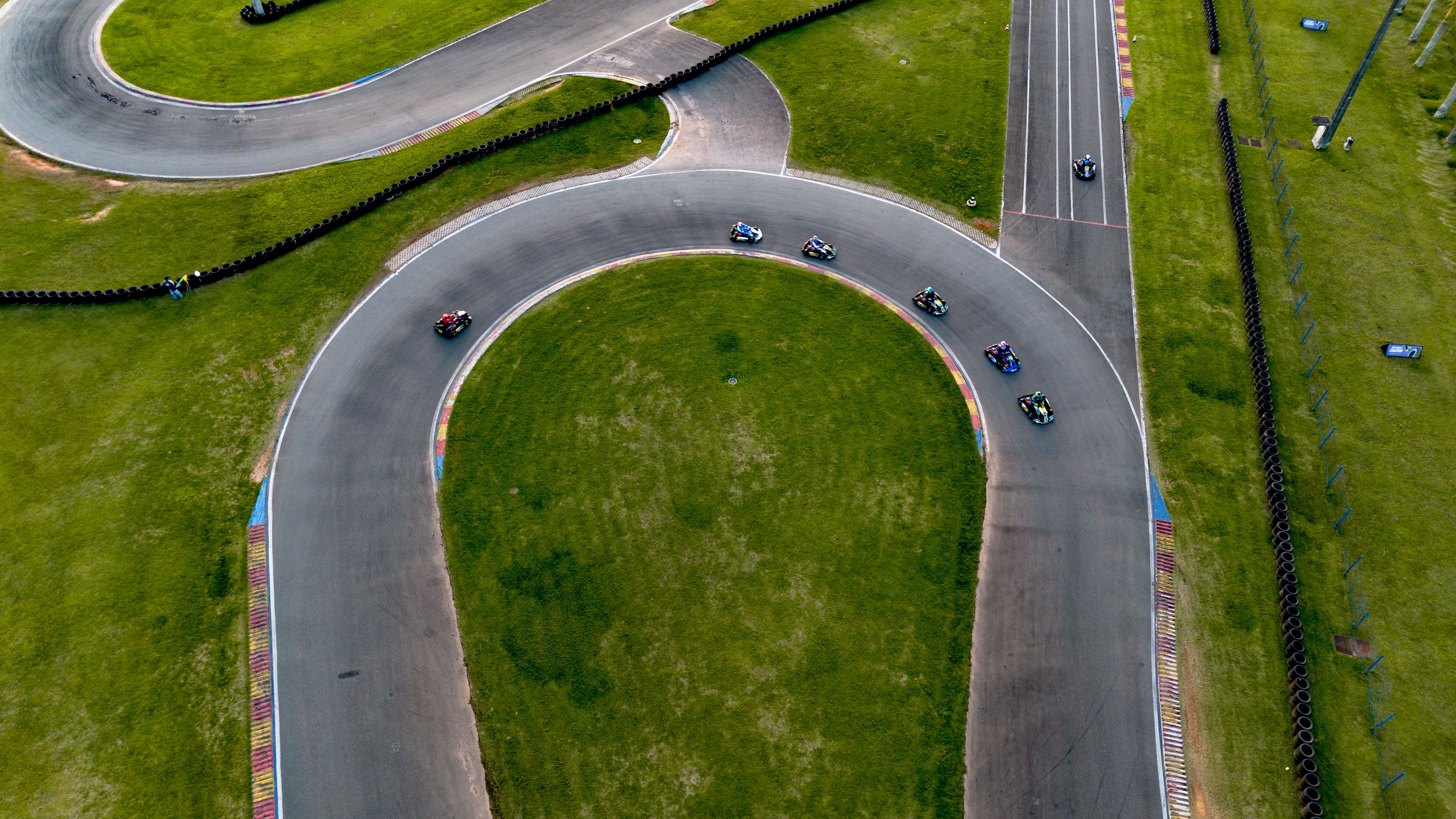 Aerial View of Kart Racing on Outdoor Track · Free Stock Photo