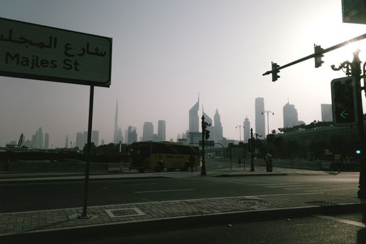 Majles Street in Dubai with the iconic skyline featuring the Burj Khalifa in the background.