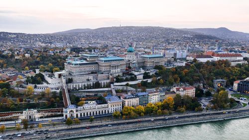 Free Stunning aerial view of Buda Castle with autumn colors in Budapest, Hungary, captured at dusk. Stock Photo
