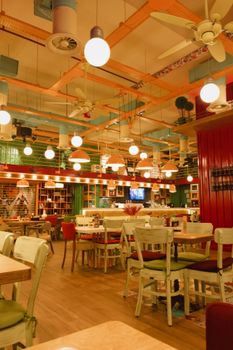 Charming restaurant interior in Konya, Türkiye with vibrant colors and cozy ambiance.