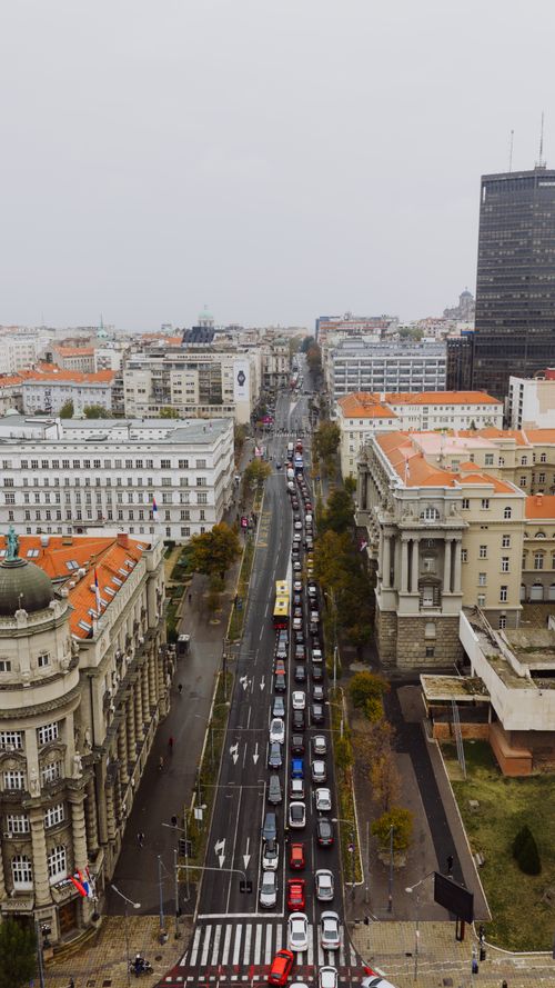 Free Drone shot of Belgrade's bustling streets and iconic architecture under an overcast sky. Stock Photo