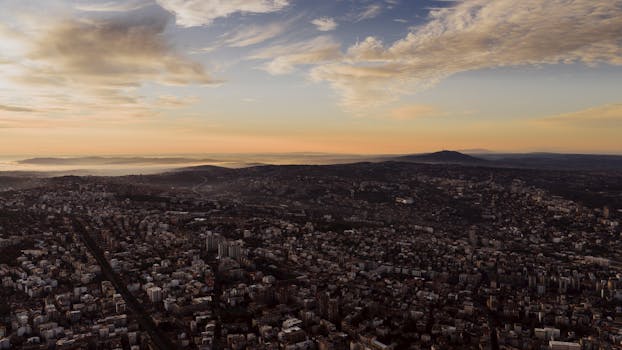 Stunning aerial shot of Belgrade, Serbia at sunrise with cityscape and scenic views.