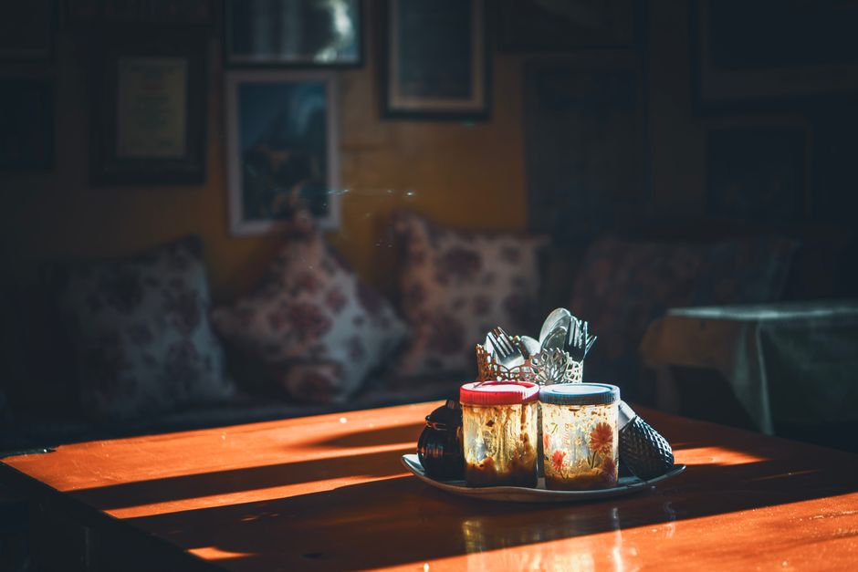 A warm, cozy table setting with natural light streaming in, creating a rustic ambiance.