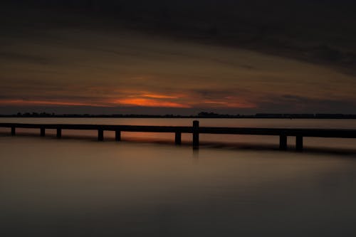 Gratis arkivbilde med lang eksponering, sjø, solnedgang