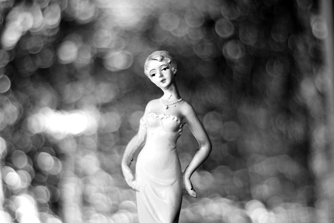 Free Grayscale Photography of Woman in Dress Figurine Stock Photo