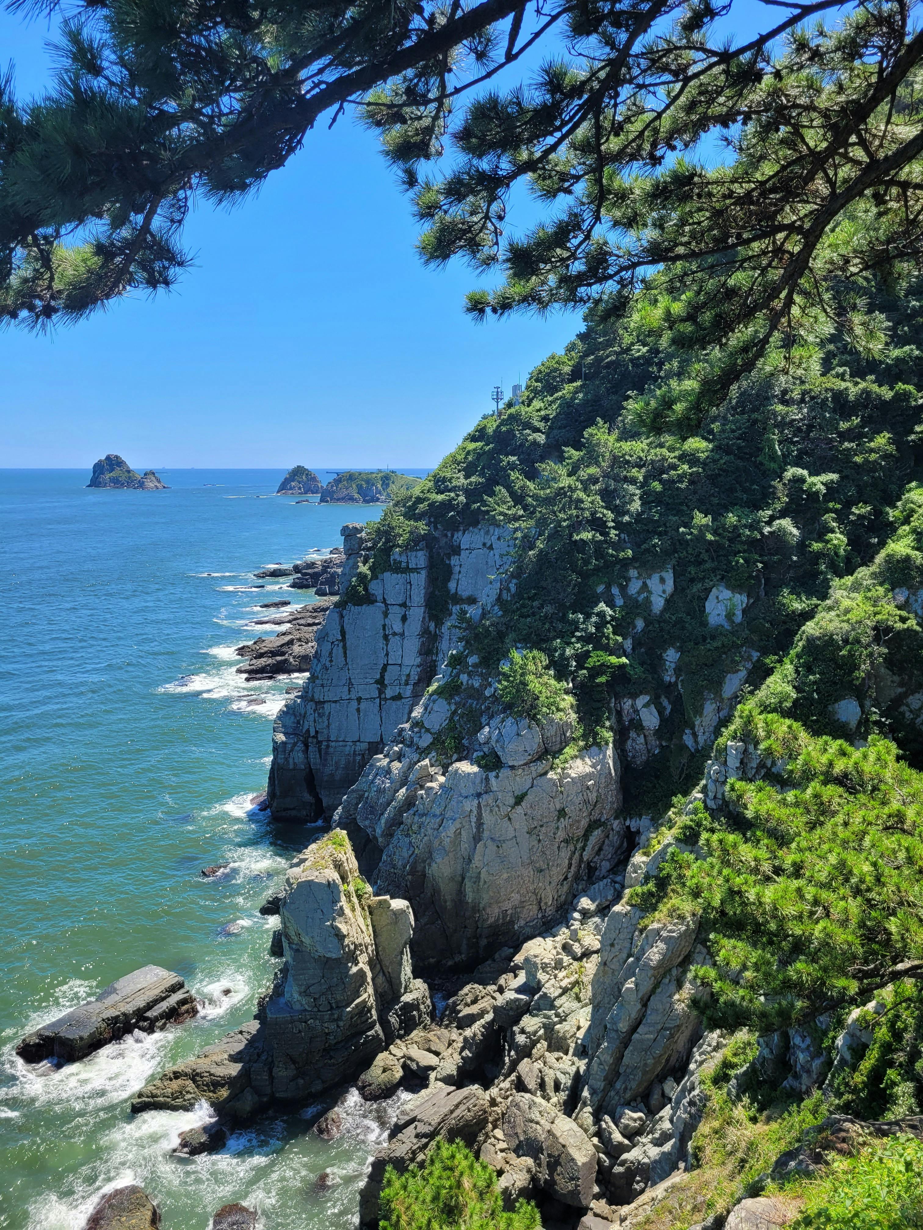 Rocky sea cliff and harbour view from the coastal trail at Labrador Nature Reserve, Singapore's only mainland sea cliff park