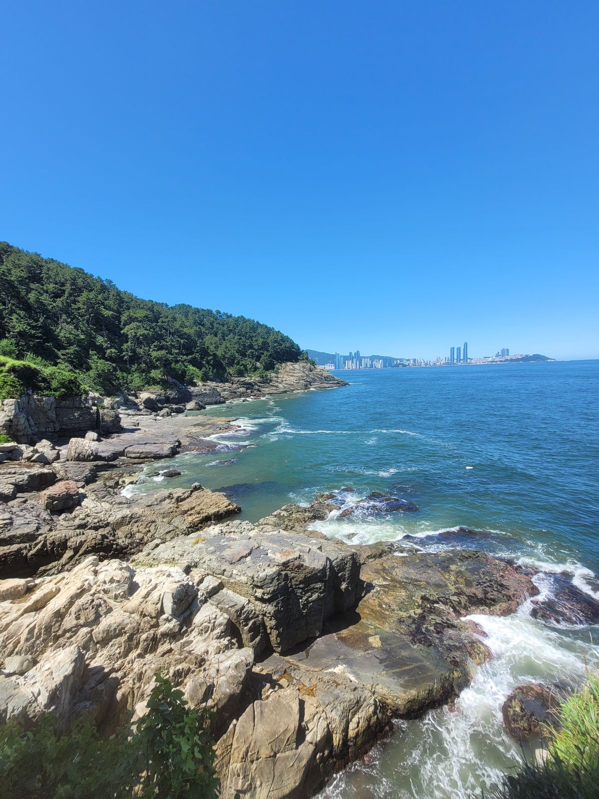 Haeundae Beach coastline and Busan skyline in South Korea