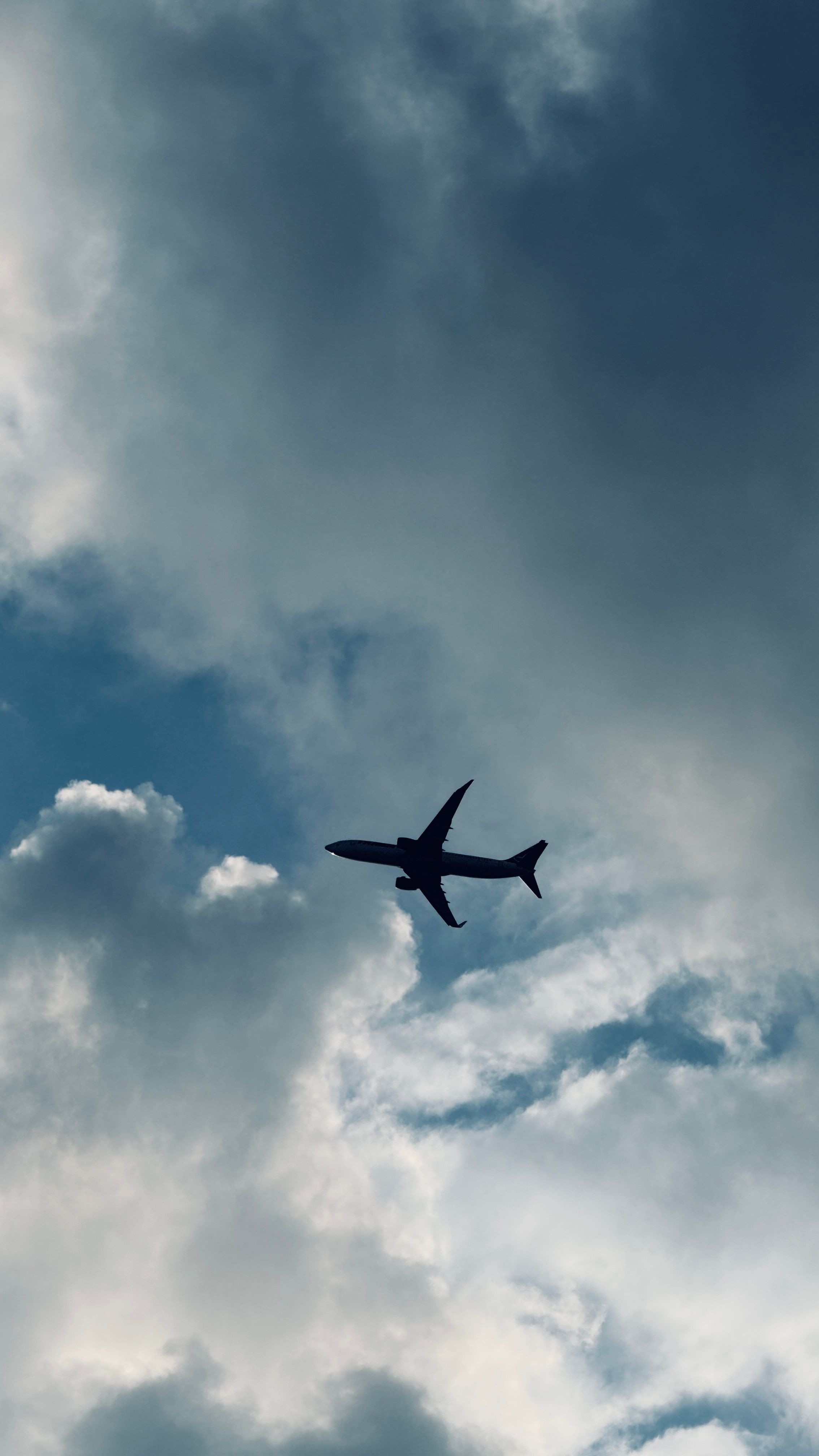 Airplane Silhouette Against Dramatic Sky · Free Stock Photo