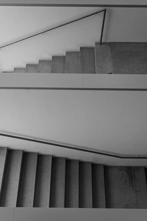 Free Modern black and white diagonal staircase in abstract architectural style. Stock Photo