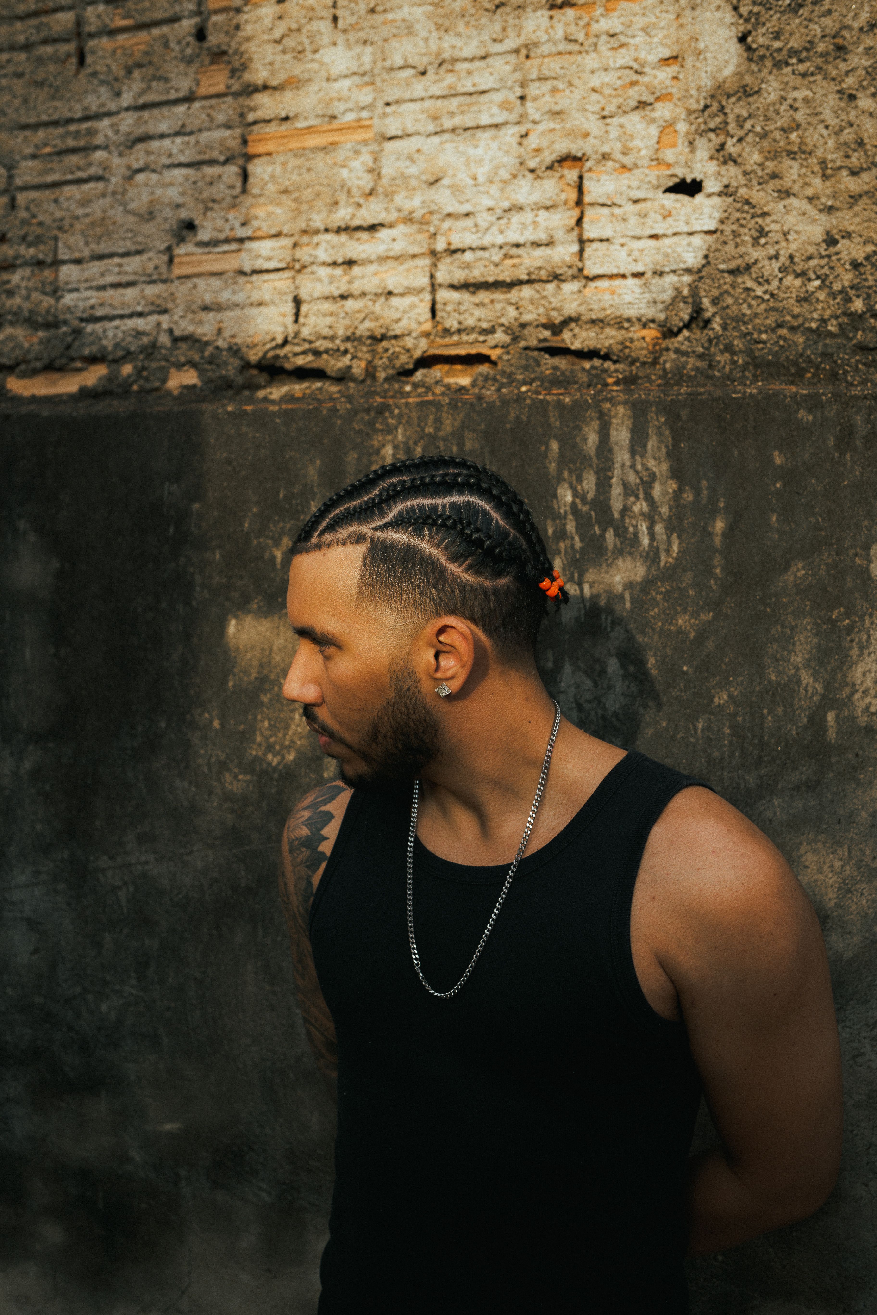 stylish-tattooed-man-with-braids-in-brazil-free-stock-photo