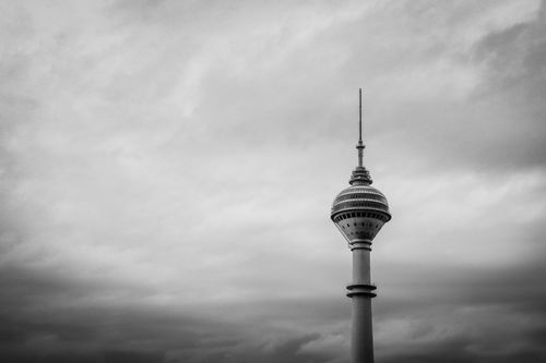 Free Black and white photo of Istanbul's notable TV tower against a cloudy sky. Stock Photo