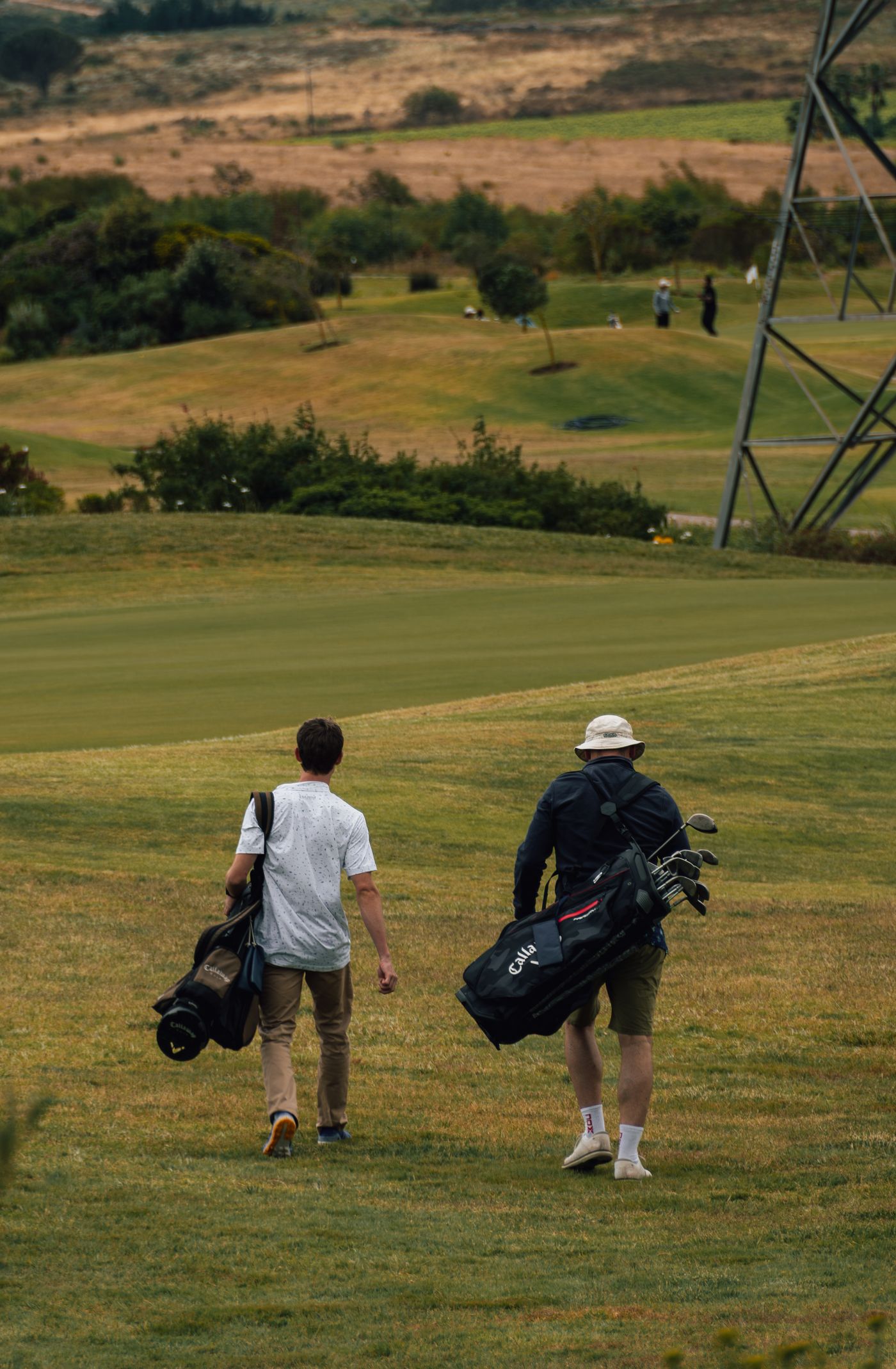 Golfers walking the fairway in perfect playing weather