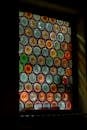 Colorful Stained Glass Window in Dark Room