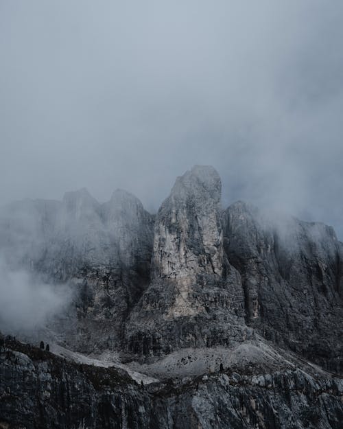 Gray Rocky Mountain Under White Sky