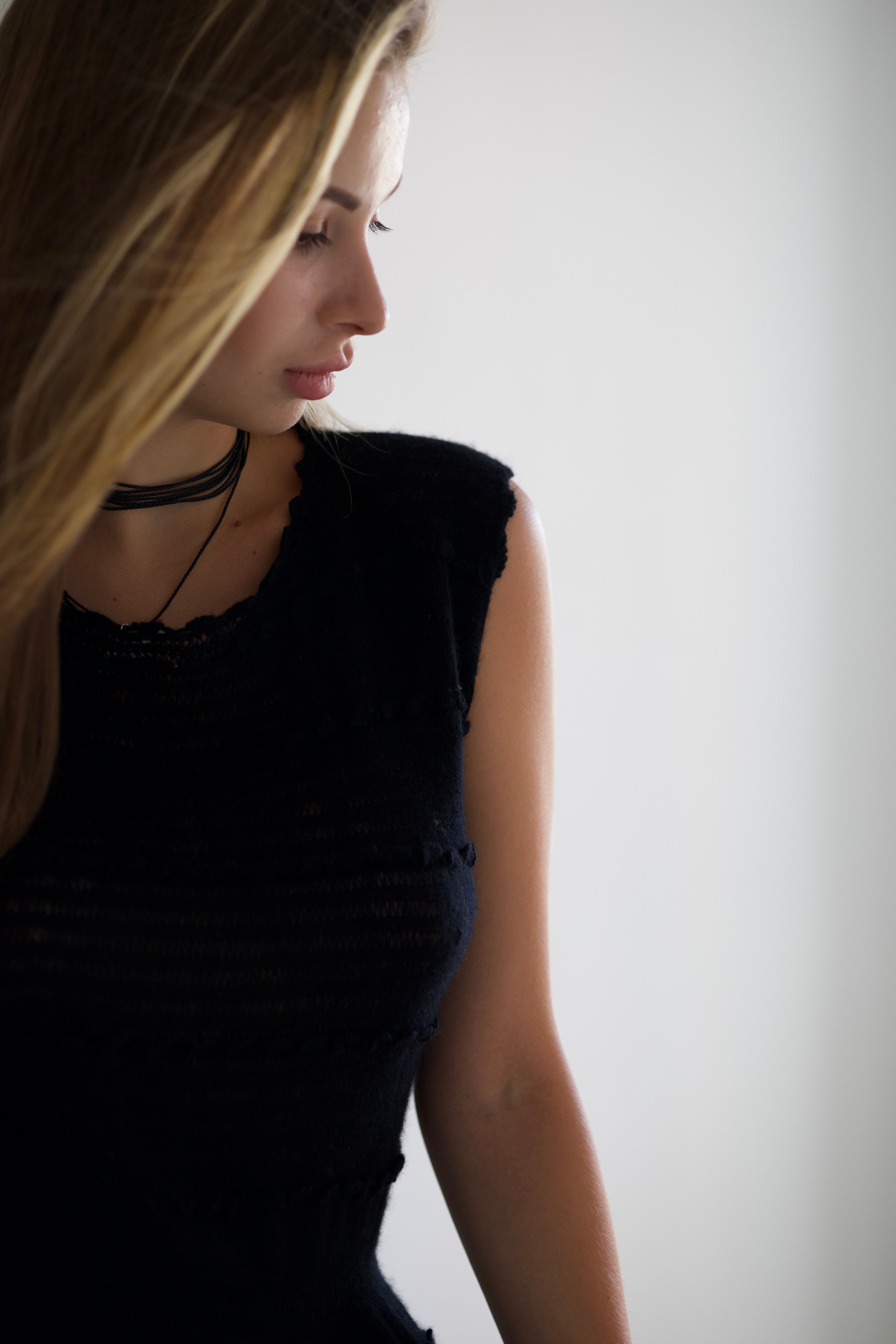Elegant Woman in Black Dress with Soft Light · Free Stock Photo