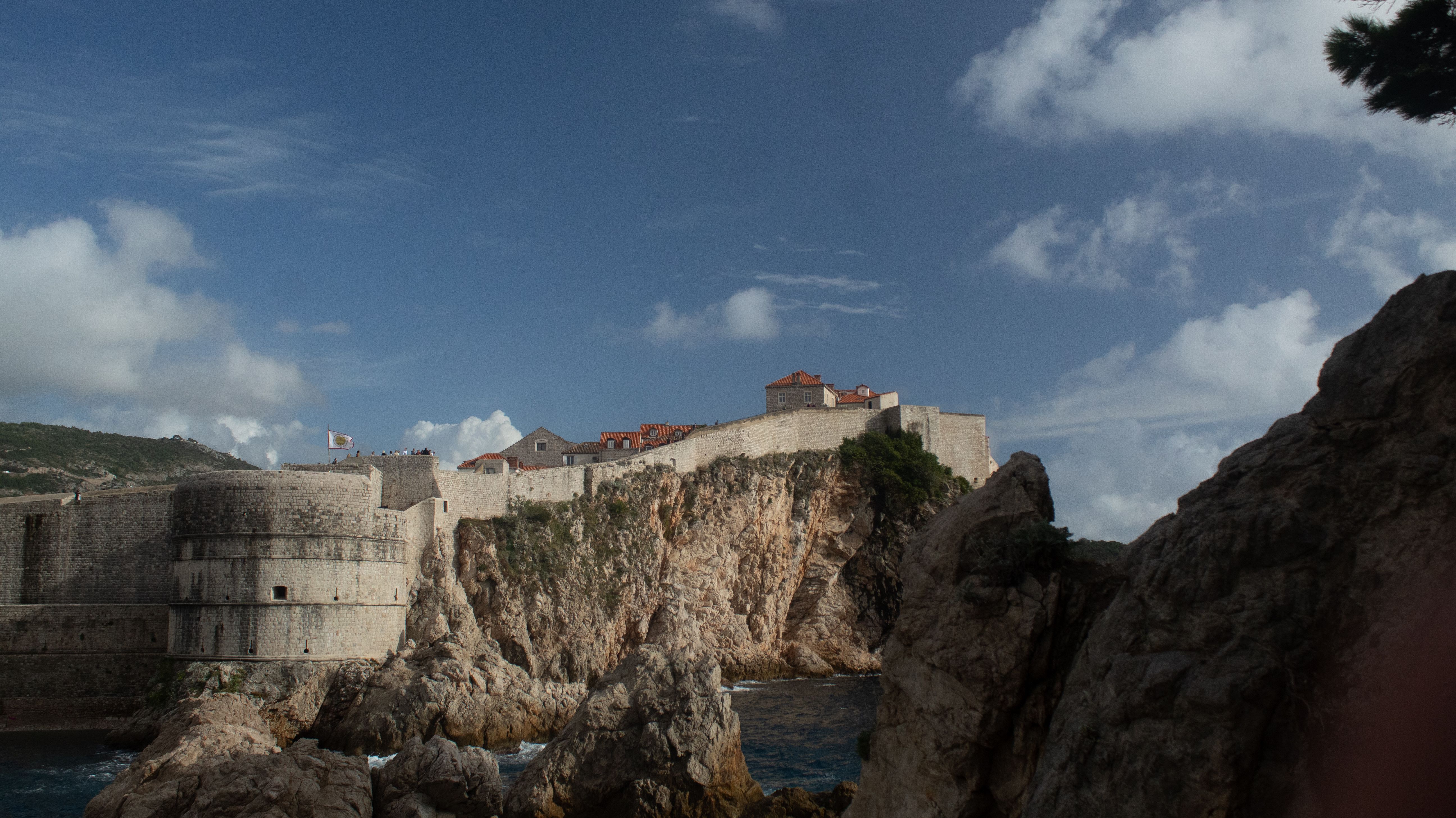 Scenic medieval fortress walls of Dubrovnik on coastal cliffs overlooking the Adriatic