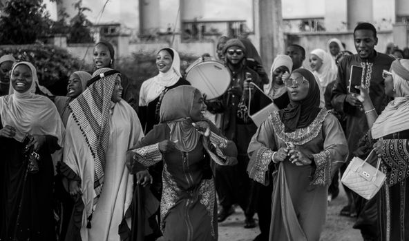 A lively gathering celebrating in traditional attire, showcasing vibrant community spirit.