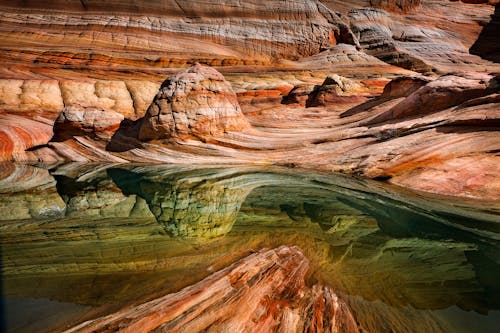 Free Close-up Photography of Body of Water and Rock Formation Stock Photo