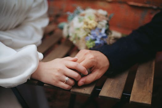 Close-up of a couple holding hands at a cafe table in Istanbul, symbolizing love and connection.
