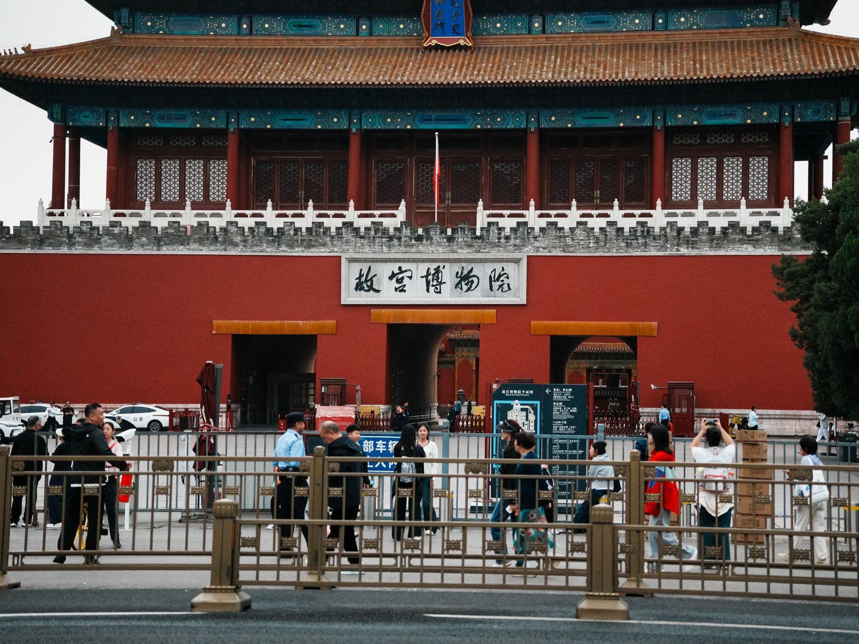Tourists gather at the historic Forbidden City entrance in Beijing, a famous cultural landmark.