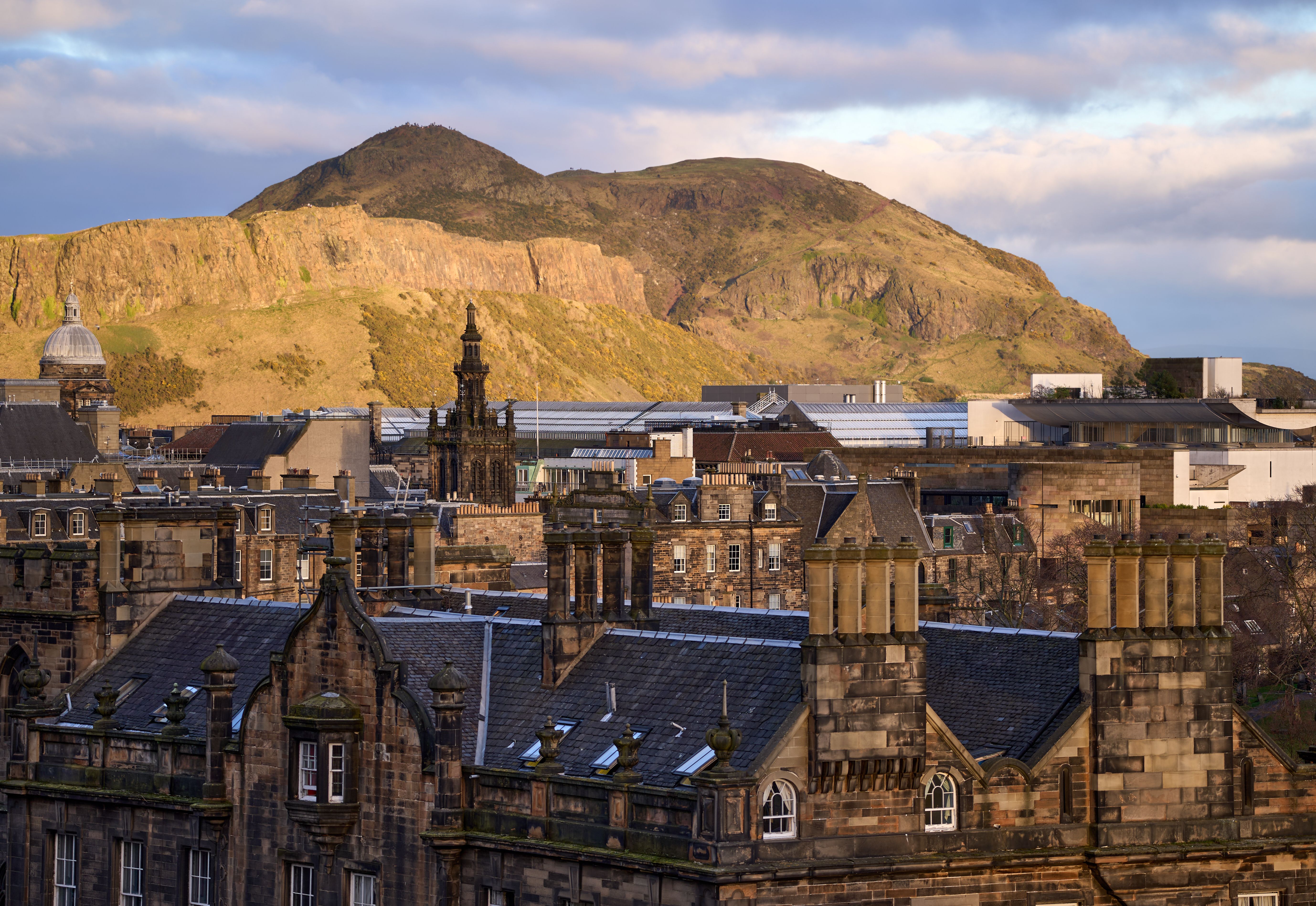 A group on an evening ghost walking tour in the historic streets of Edinburgh, Great Britain