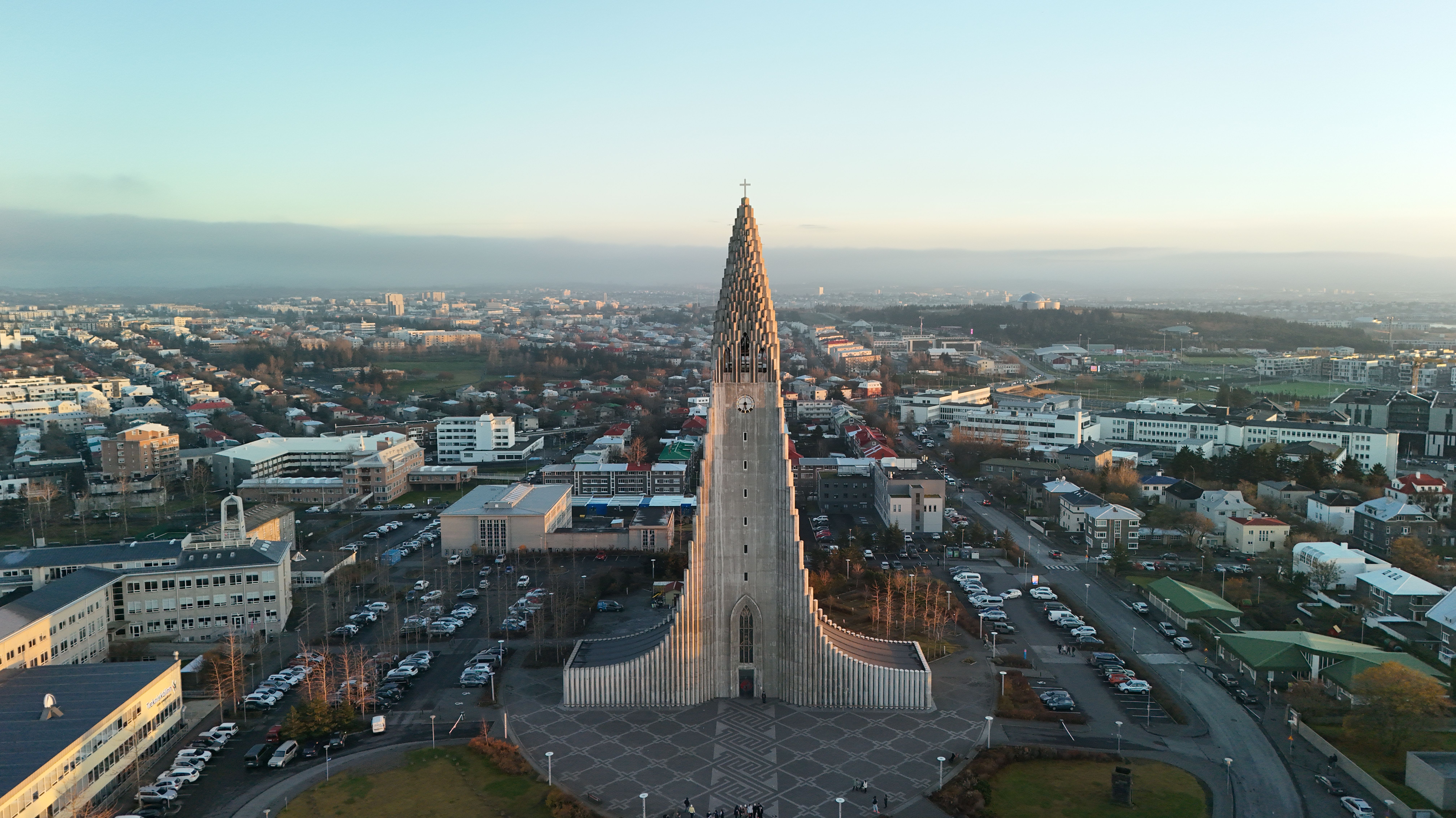 Stunning aerial shot of Hallgrímskirkja in Reykjavik, Iceland, at sunrise showcasing the city's architecture.