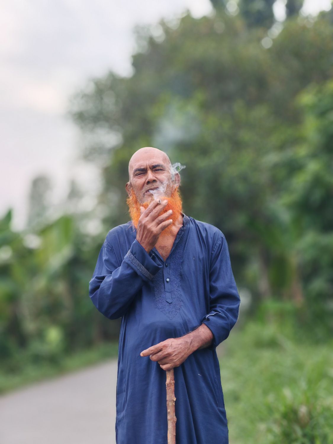 Young Rural Smokers Elderly Man Smoking in Rural Pathway Setting · Free Stock Photo