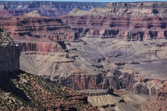 The red-rock walls above the village of Supai in the side canyon