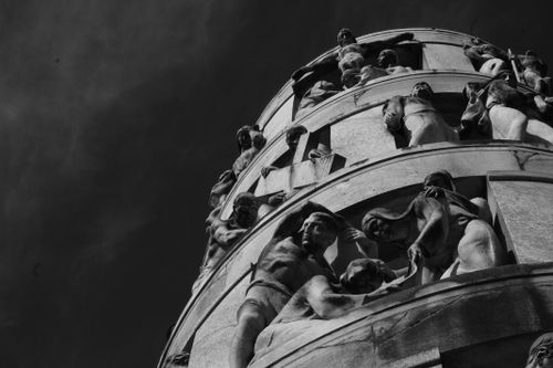 Free Black and white photograph capturing detailed sculptures in Milano's monumental cemetery. Stock Photo