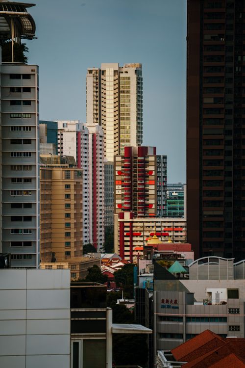 Free Skyline showcasing diverse architectural styles in a vibrant urban setting at dusk. Stock Photo