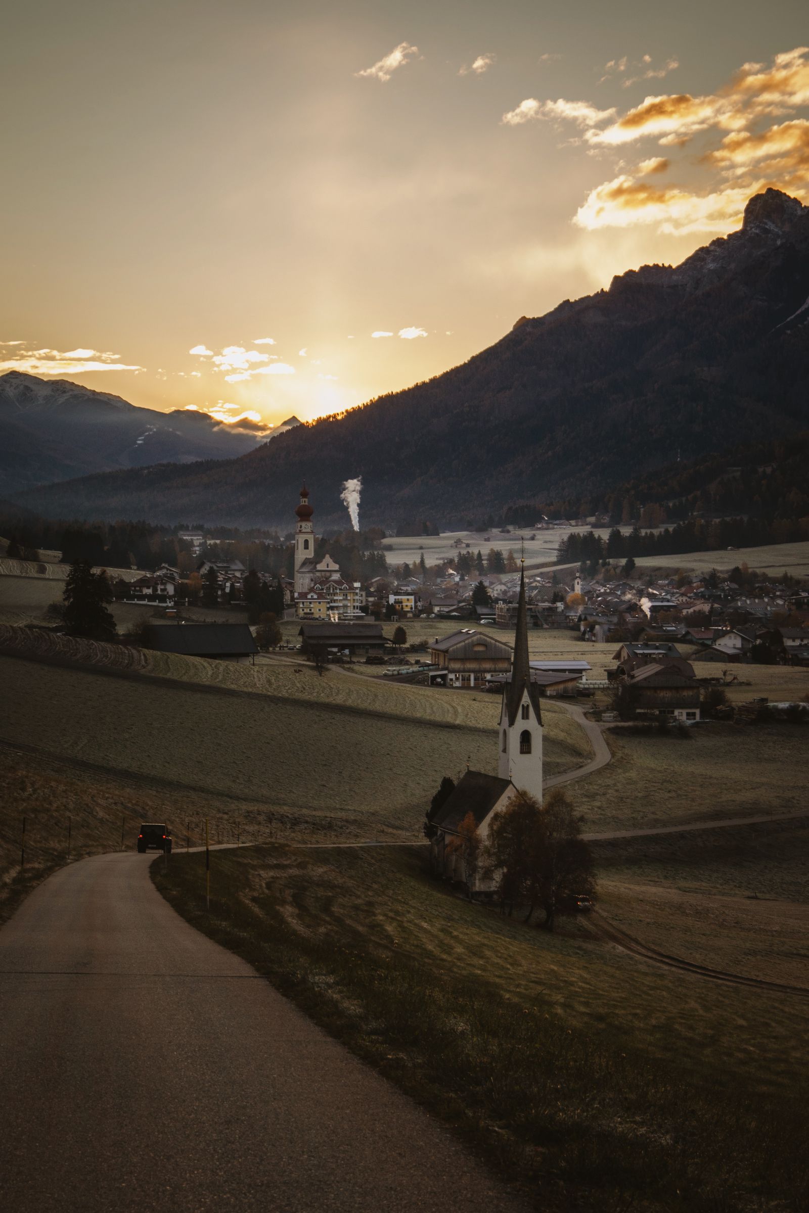 A European alpine range under a fiery sunset
