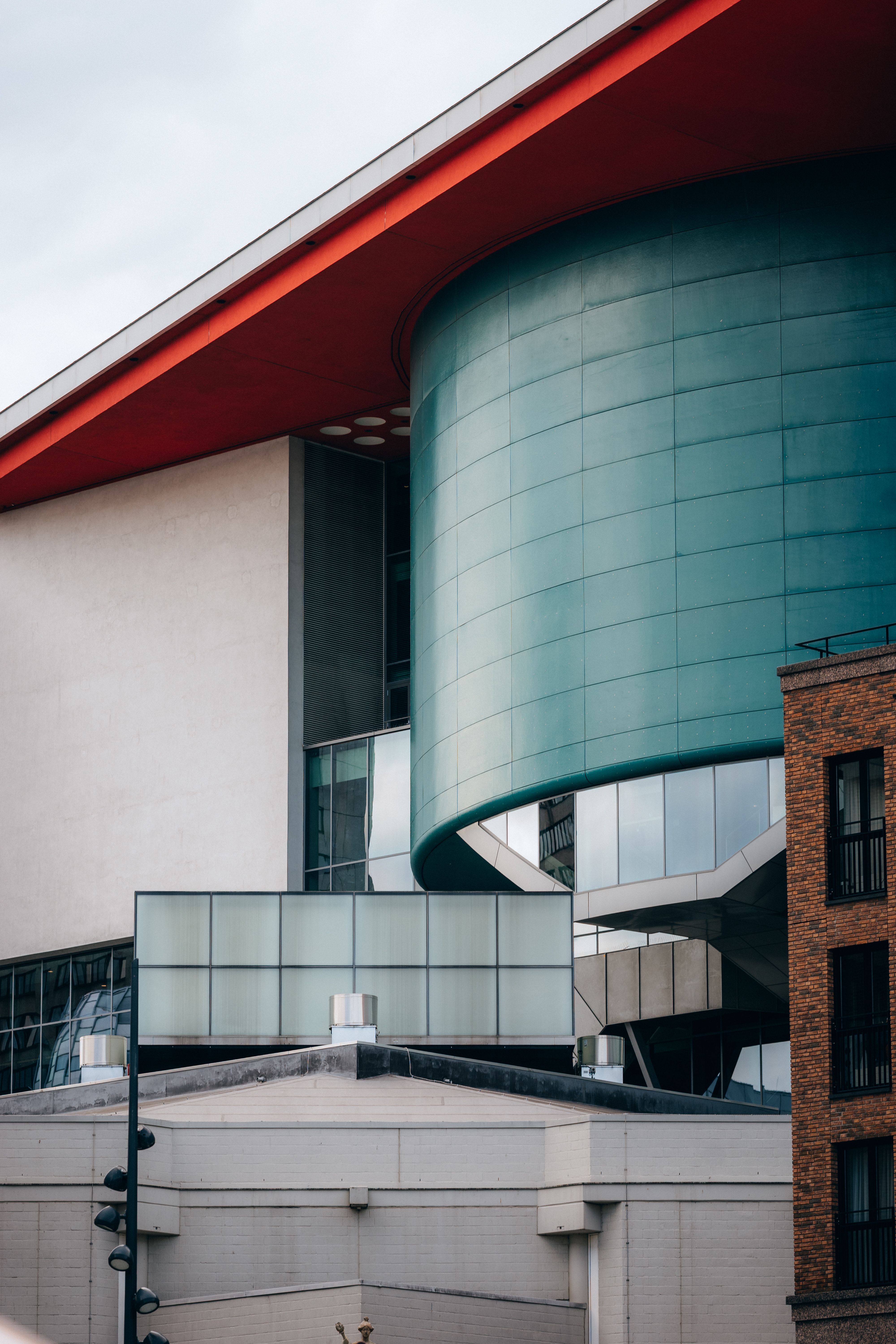 Modern Architectural Building with Red Roof · Free Stock Photo