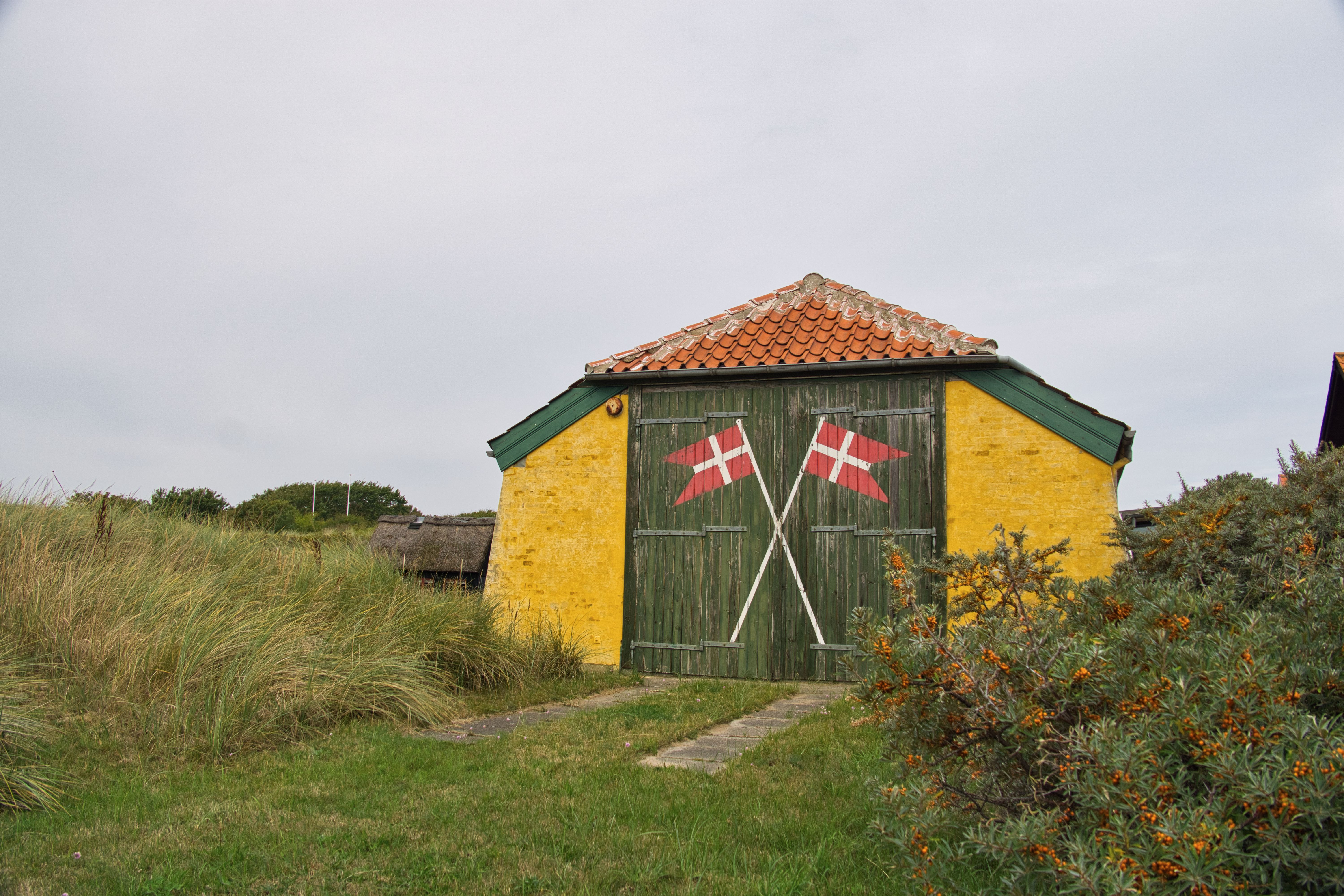 Scenic Danish Barn with Decorative Flags · Free Stock Photo