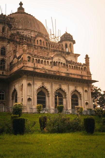 Historical building in Lucknow's lush landscape, showcasing Indo-Islamic architecture.
