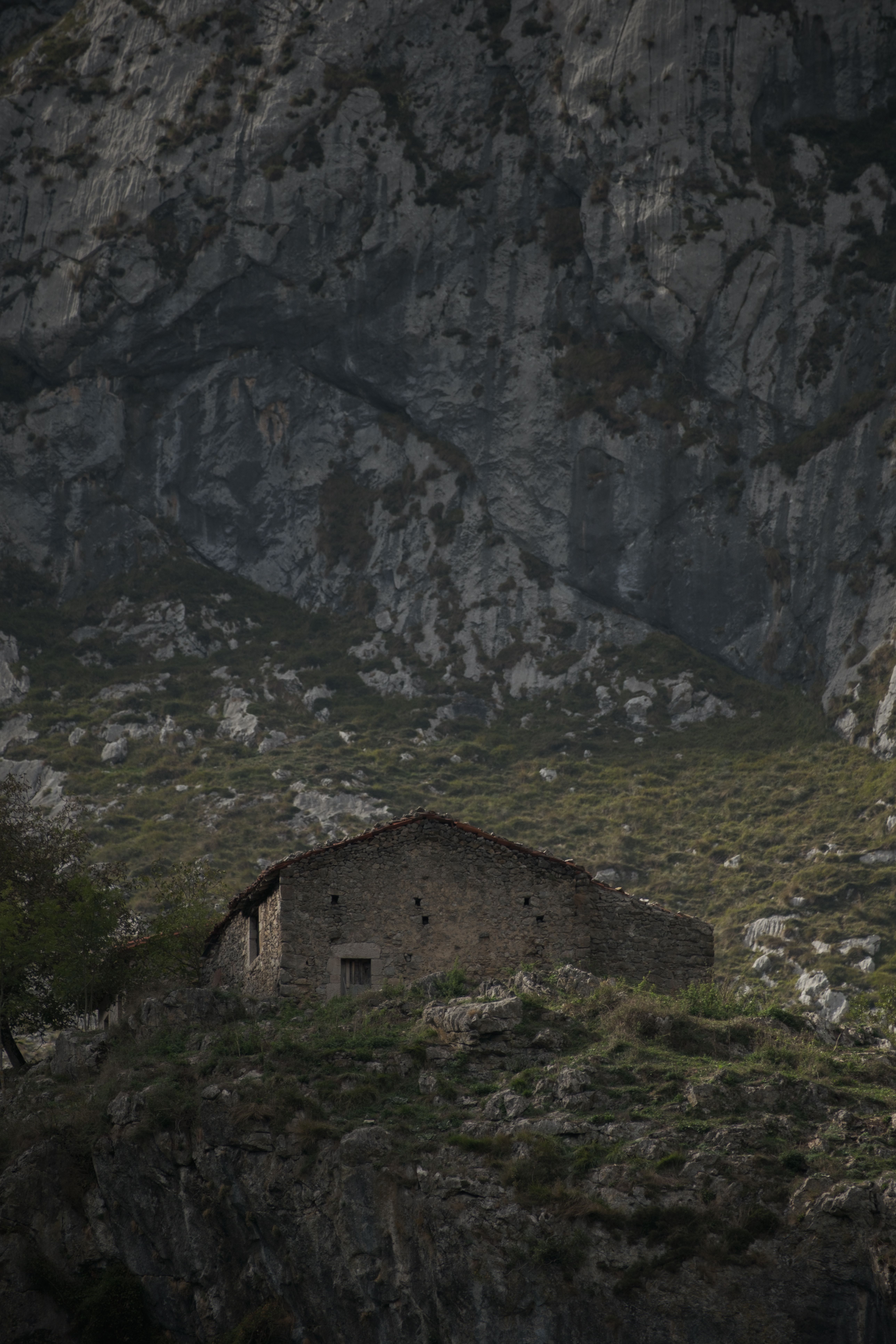 Rustic Stone House in Rocky Mountain Landscape · Free Stock Photo