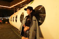 Stylish Woman in Houndstooth Coat at Night