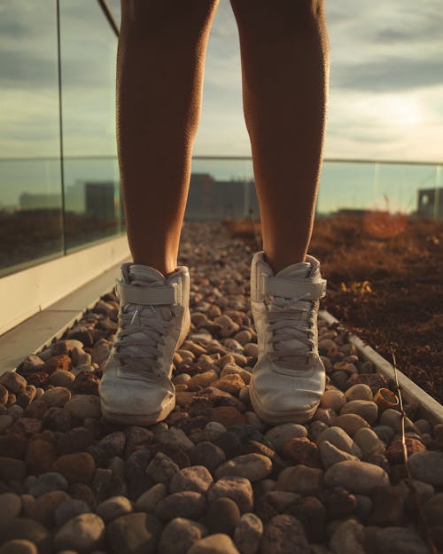 Person Wearing White Sneakers