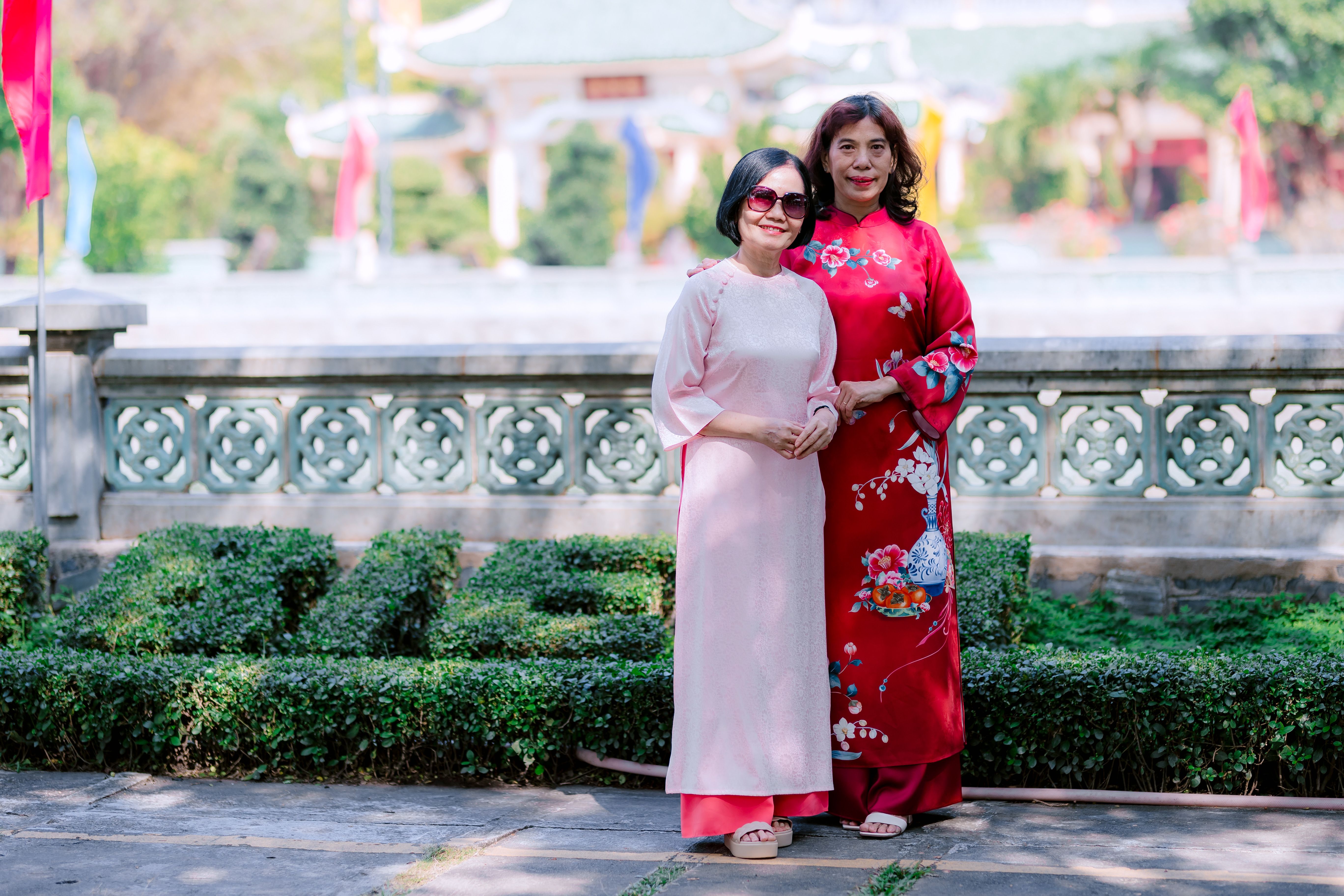 Two Women in Traditional Asian Dresses Outdoors · Free Stock Photo